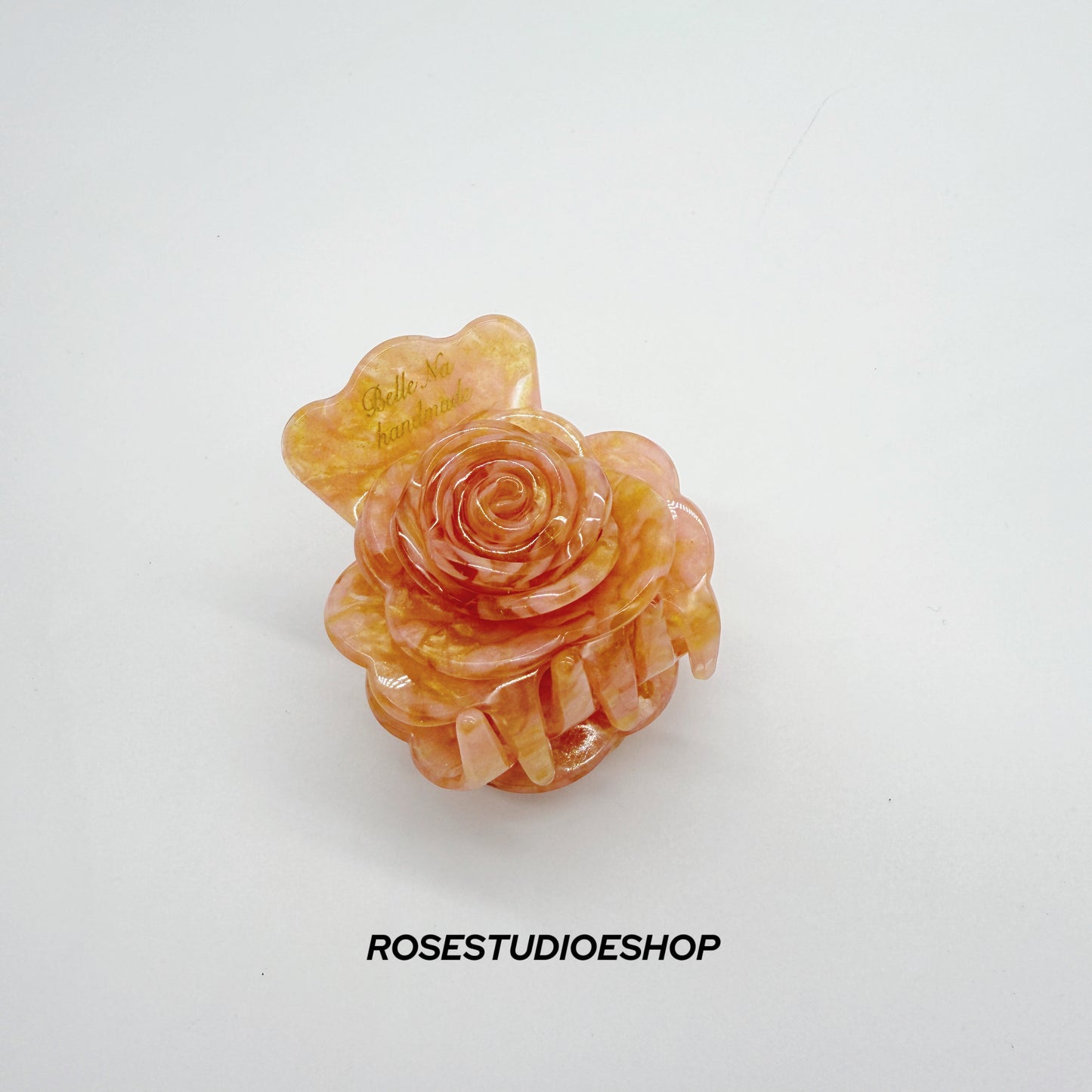 Middelgrote acetaat haarclip met roos