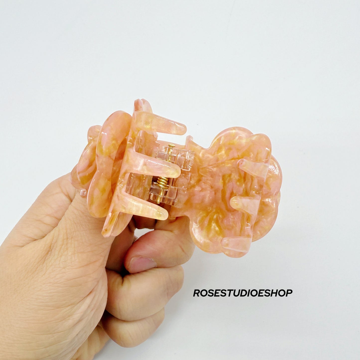 Middelgrote acetaat haarclip met roos