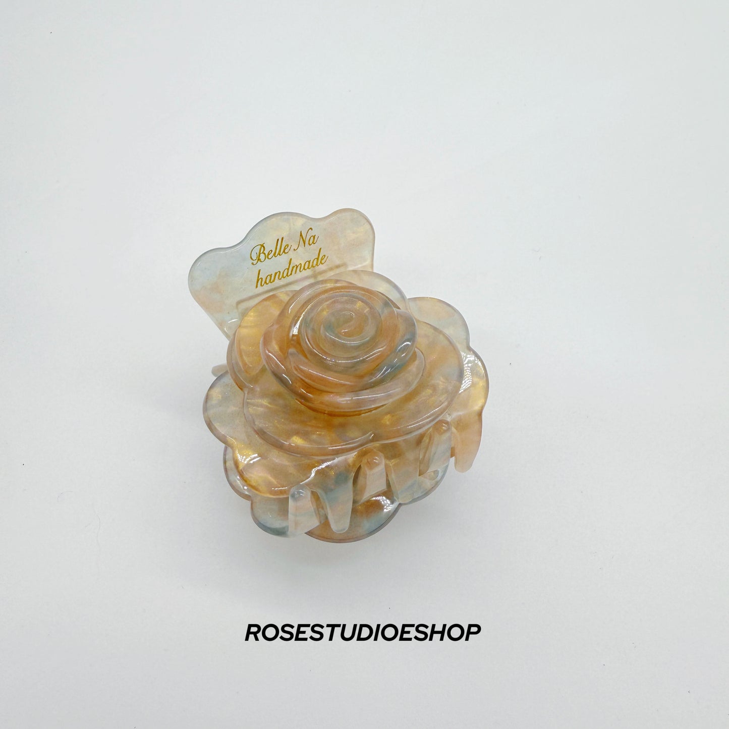 Middelgrote acetaat haarclip met roos