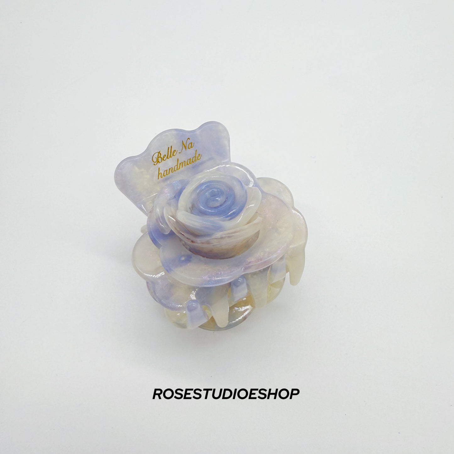 Middelgrote acetaat haarclip met roos