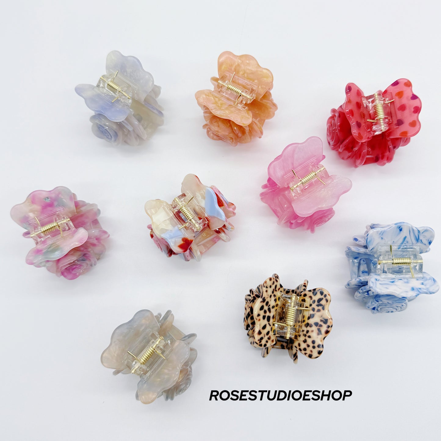 Middelgrote acetaat haarclip met roos