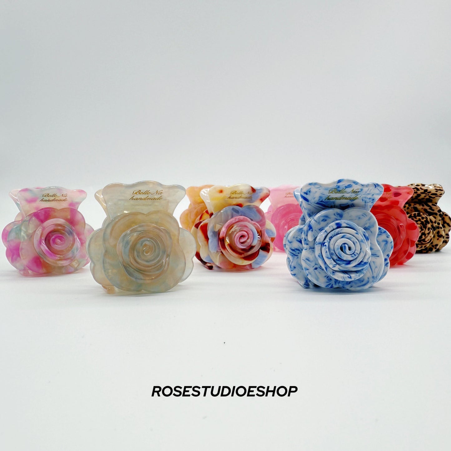 Middelgrote acetaat haarclip met roos