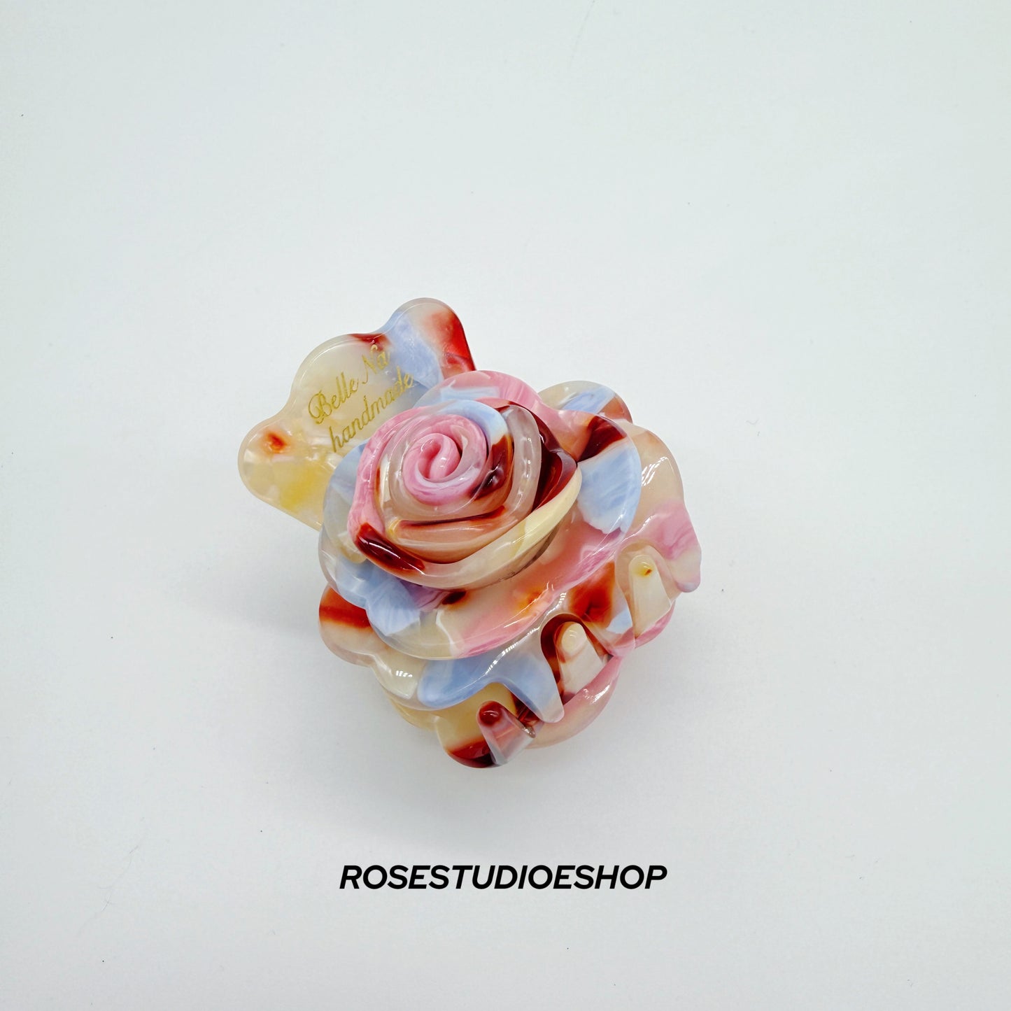 Middelgrote acetaat haarclip met roos